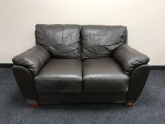 A pair of brown leather two seater settees