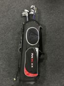 A Dunlop golf bag containing a set of child's irons