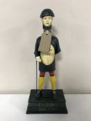A cast iron Guinness figure