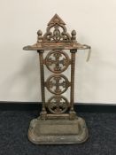 An early 20th century cast iron stick stand with lift out tray