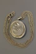 A Victorian silver locket on triple strand silver guard chain