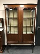 An Edwardian inlaid mahogany display cabinet