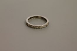 A white gold diamond set eternity ring,