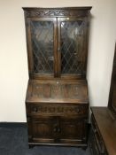A Chapmans Siesta oak linen fold bureau bookcase