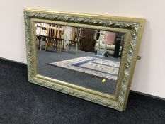 An ornate gilt framed mirror