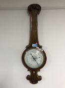 A carved mahogany banjo barometer