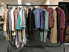 A rail of mid 20th century vintage lady's clothes