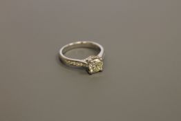 An 18ct gold solitaire diamond ring, the principal brilliant-cut stone weighing approximately 0.