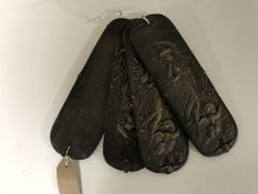 Four cast iron finger plates