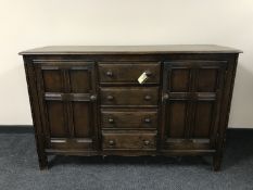 An Ercol double door sideboard fitted four drawers