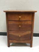 A Willis & Gambier three drawer bedside stand