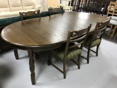 A circular continental oak dining table,