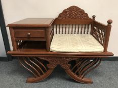 A hardwood telephone seat