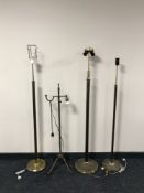 A continental brass rise and fall standard lamp and three others