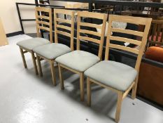 A set of four oak ladder back chairs