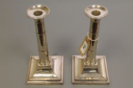 A pair of silver plated candlesticks, with sconces, 24.