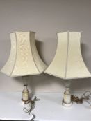 A pair of marble table lamps with shades