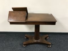 A Victorian mahogany pedestal bed table