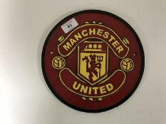 A cast iron Man U plaque