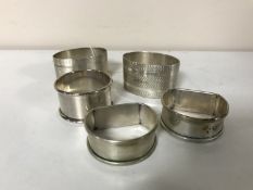 A box of five assorted sterling silver napkin rings