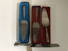 A sterling silver handled bread knife and three silver handled cake knives