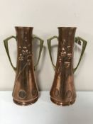 A pair of Arts and Crafts copper brass handled vases,