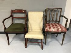Two carver armchairs and a mid 20th century vinyl upholstered nursing chair