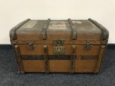 An early 20th century wooden bound travelling trunk