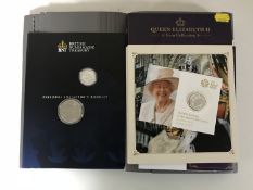 Two £20 silver proof coins in collector's albums with one other