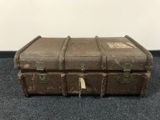 An early 20th century wooden bound travelling trunk