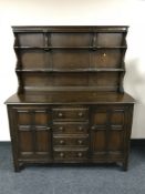 An Ercol double door sideboard fitted four drawers