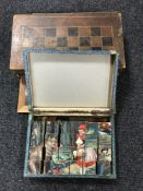 A vintage leather bound chess board in the form of two books,