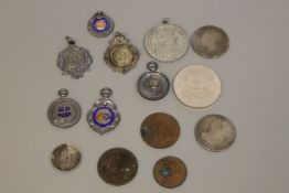 A quantity of sterling silver football medals, Victorian and later coins,