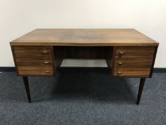 A mid 20th century Danish rosewood twin pedestal desk fitted six drawers