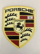 A cast iron Porsche wall plaque