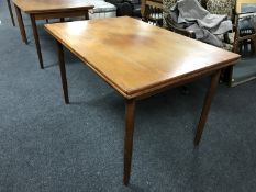 A late 20th century Danish teak extending dining table