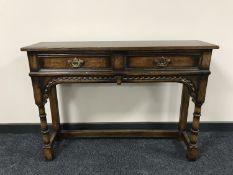 A Chapmans Siesta oak Georgian style side table fitted two drawers