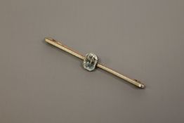 A gold and platinum bar brooch set with an aquamarine CONDITION REPORT: The brooch