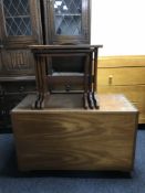 A 1970's teak blanket box and a nest three tables