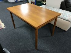 A late 20th century Danish teak extending dining table