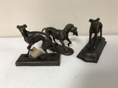 Three small cast iron dog figure
