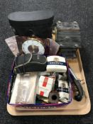 A set of cased binoculars, a Betima 8 day mantel clock, postcards, cigarette cards,