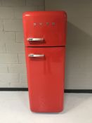 A red Smeg fridge freezer