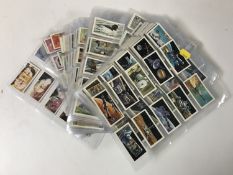 A collection of assorted tea cards in plastic wallets