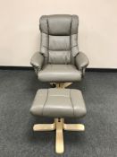 A grey leather relaxer chair with footstool (unused)