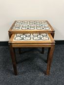 A nest of two Danish rosewood tiled topped tables