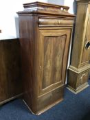 An early 20th century mahogany pillar cabinet