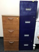A three drawer beech filing chest and pair of two drawer metal filing chests