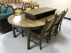 A circular continental oak dining table,