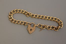 A 9ct gold padlock bracelet, 12.